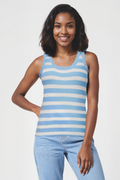 Woman wearing a blue and white striped sleeveless top with light blue jeans on a white background. #color_little-boy-blue-colette-stripe