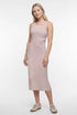A woman modeling a sleeveless midi dress with horizontal light brown and white stripes, paired with beige sneakers, against a plain white studio background. 