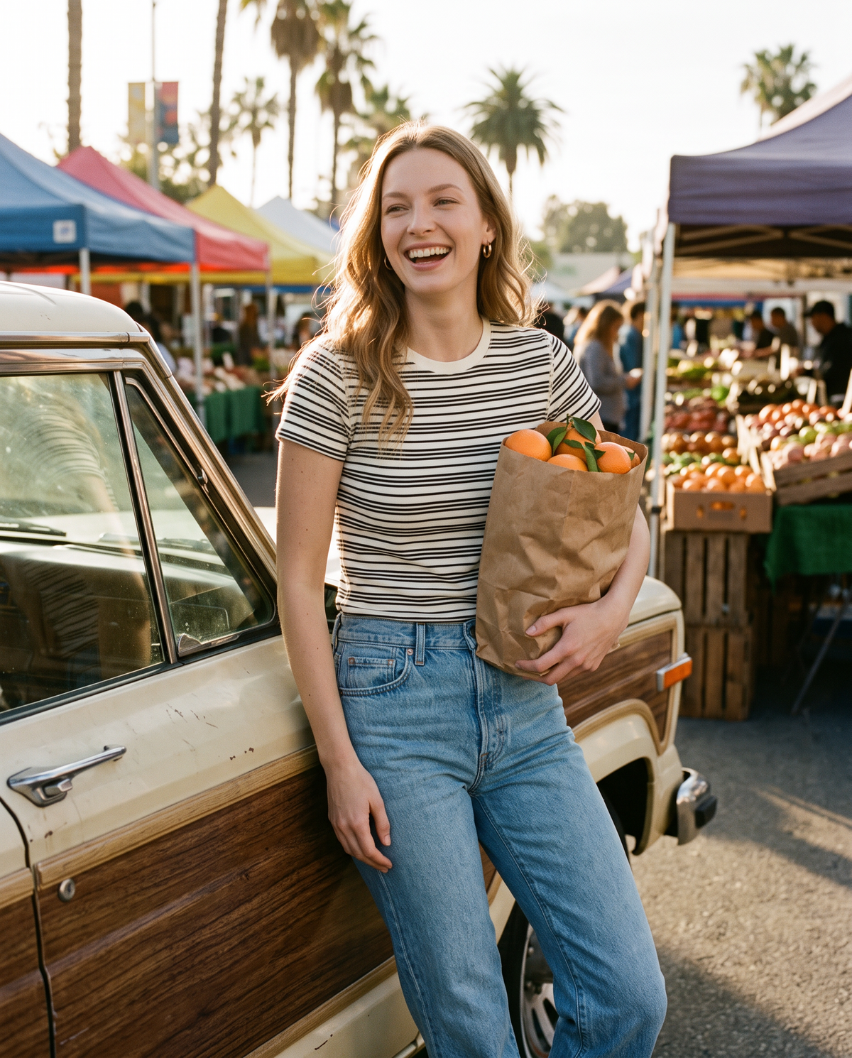 Woman at a farmers market in a striped crew neck tee and jeans